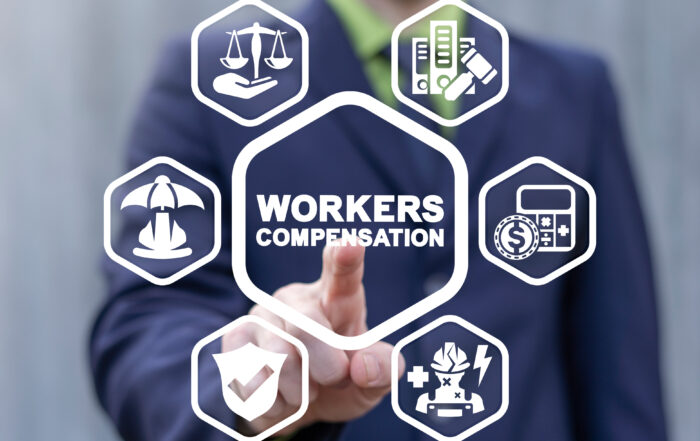 Businessman pressing digital interface showing workers’ compensation icons including legal, insurance, and claim-related symbols.